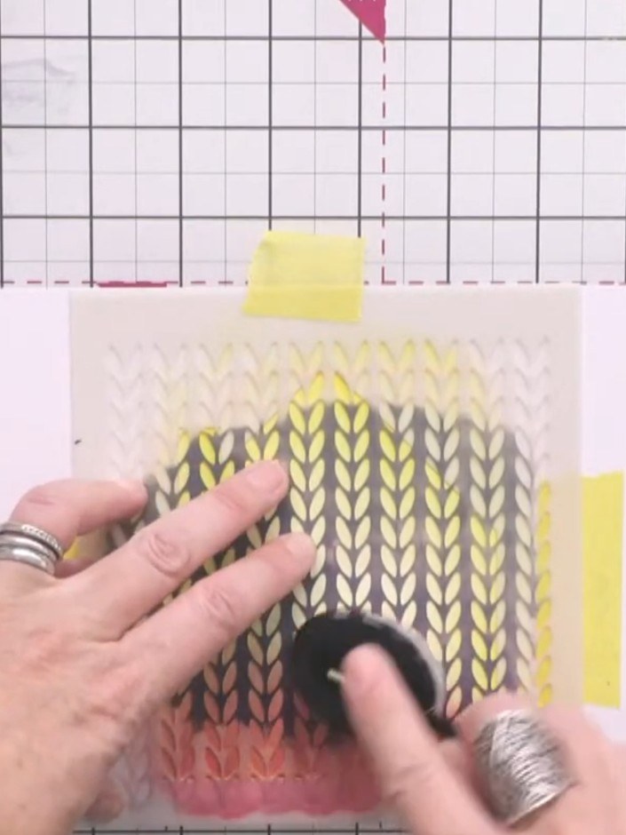 Step 4: Position the knitted pattern stencil over the card and apply bittersweet ink to the lower portion using a blen