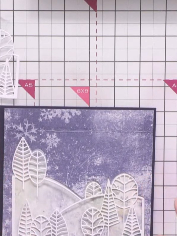 Step 3: Die-cut the country view scene from blue cardstock to create the landscape aperture. This will form the main f