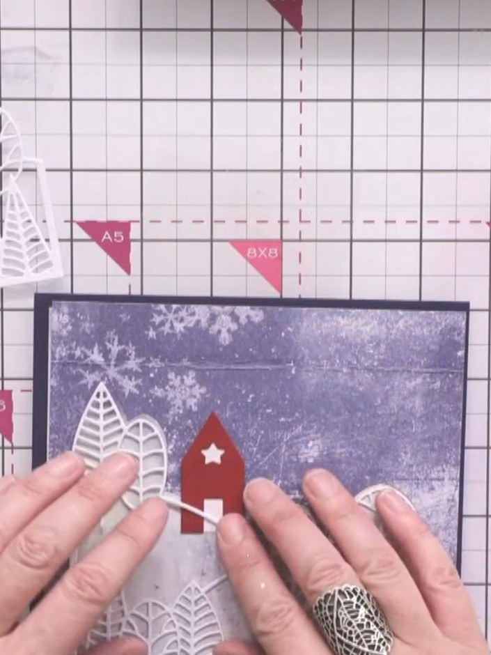 Step 5: Use a white gel pen to mark the position for a small red house on the hilltop, ensuring it sits above the land