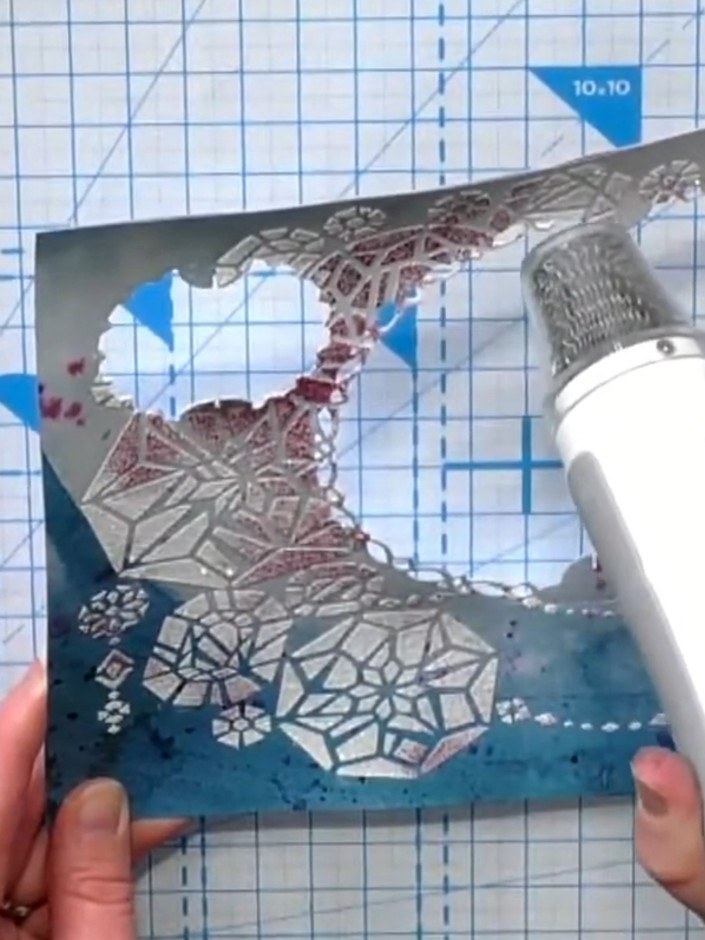 Step 7: Use a heat tool to heat-set the embossing powder, moving it over the design until the powder melts and the cra