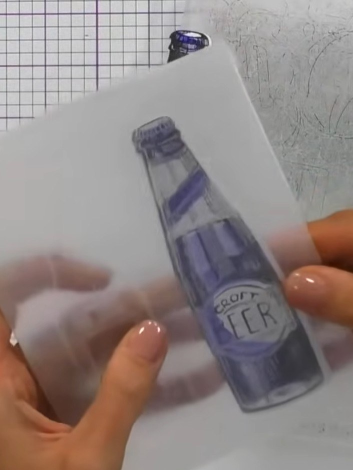 Step 7: Place your die-cut craft beer bottle into the embossing folder, ensuring it is positioned correctly with the r
