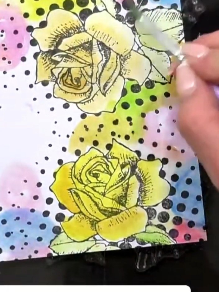 Step 5: Using a contrasting colour ink (such as black), stamp random circles or dots over the wet watercolour backgrou