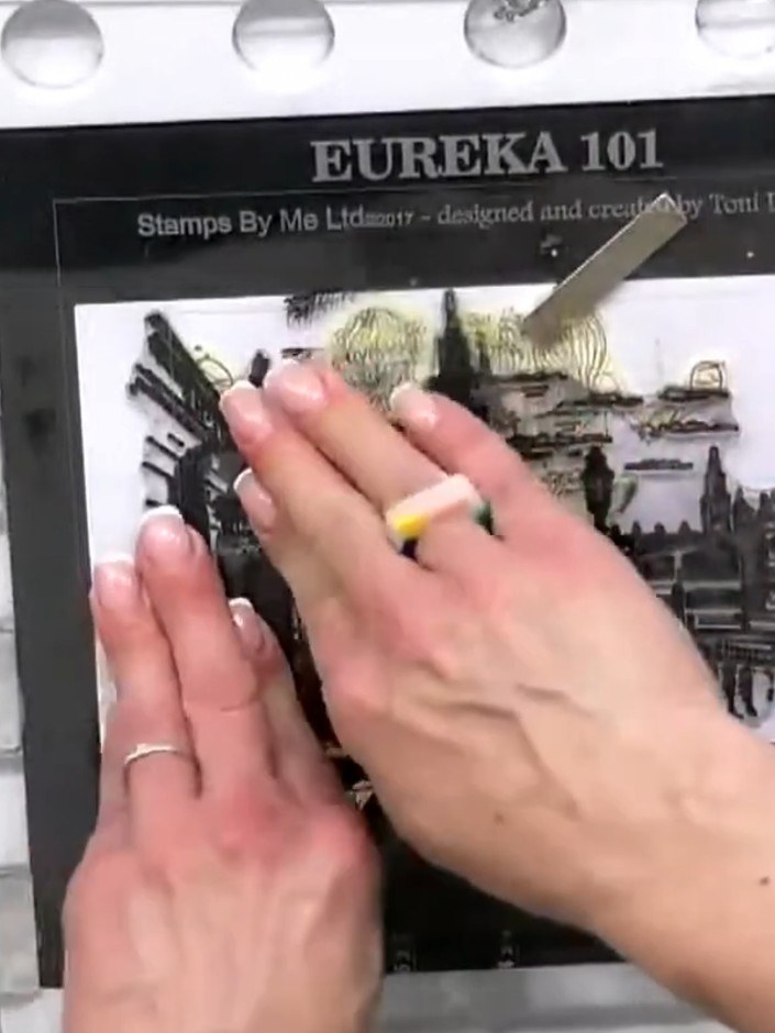 Step 4: Stamp a second image directly over the masked area using all-purpose ink. Position the London or chandelier st