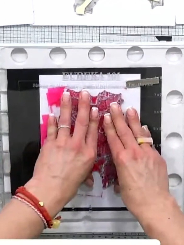 Step 2: Using a water brush, apply clean water over the stamped image. Work gently to cover the entire stamped area wi
