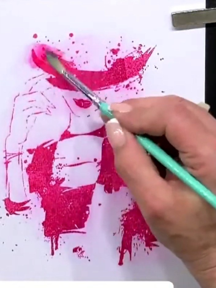 Step 3: Using a wet brush, blend the magenta ink outward from the stamped lines to soften and diffuse the colour acros