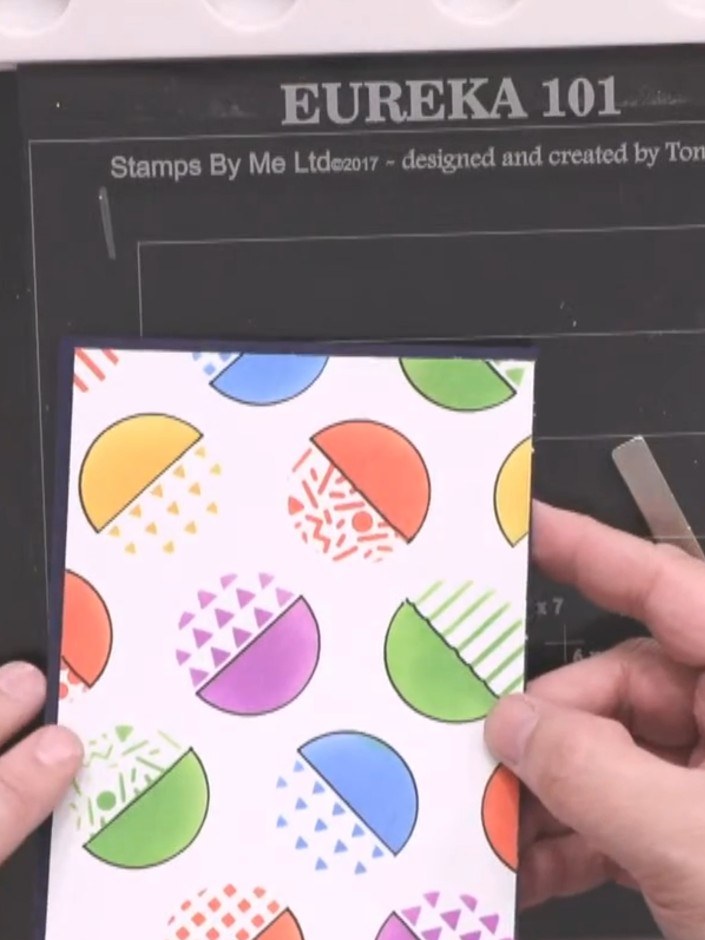 Step 1: Prepare a white card base measuring slightly larger than 5 by 7 inches. Trim the card to size using a trimmer 