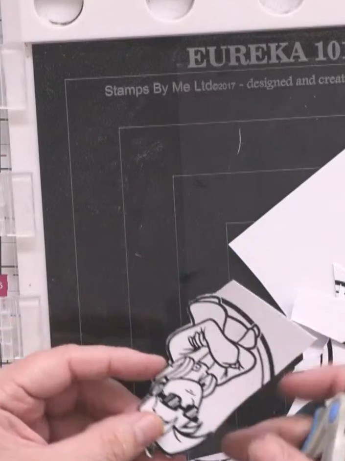 Step 13: Apply black embossing powder to the stamped sentiment. Heat the embossing powder with a heat tool until it bec
