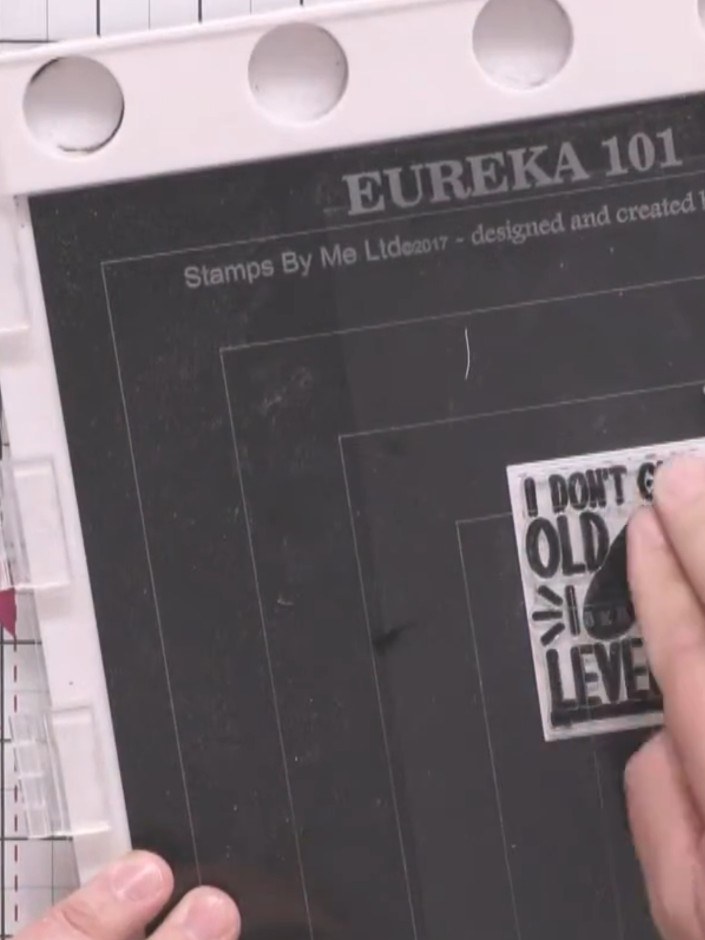 Step 14: Mount the sentiment square onto black card to create a mat layer. Use scissors or a craft knife to trim around