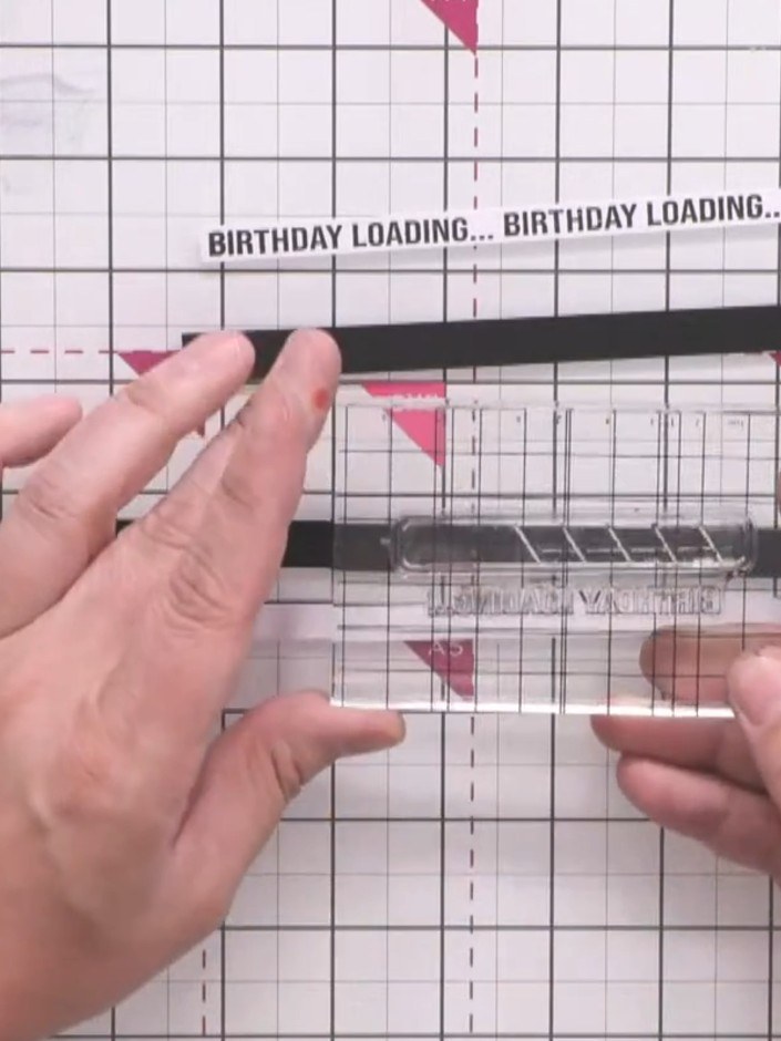 Step 6: Glue the black-backed sentiment strips between the coloured background strips to break up the join lines. Posi