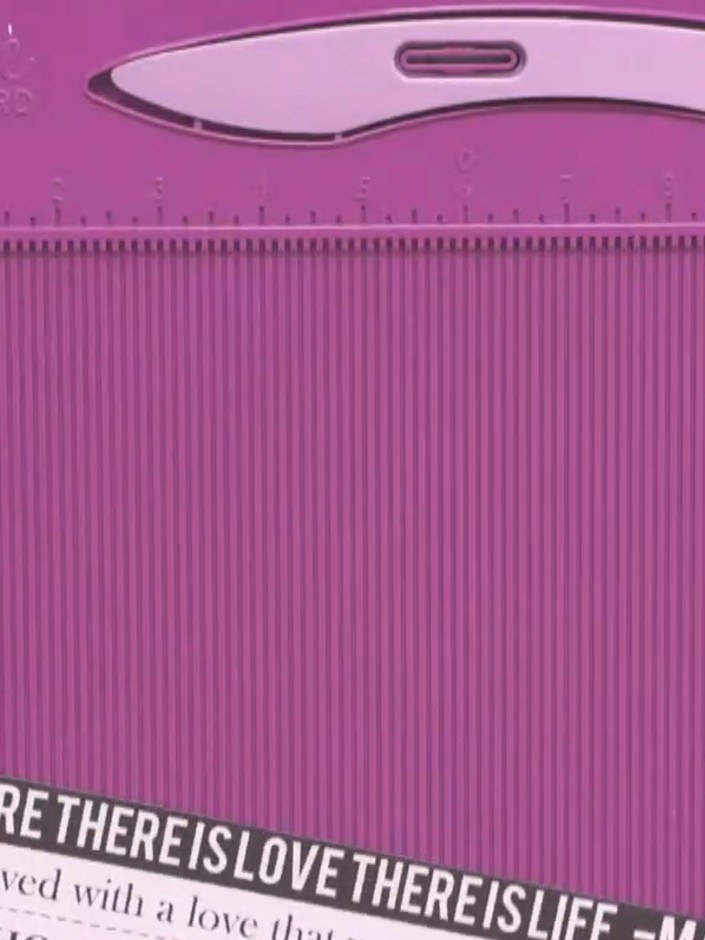 Step 2: Fold the pink corrugated card in half along the score line to create a hinge.