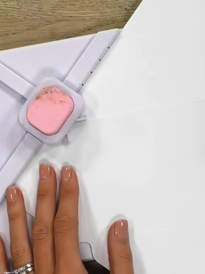 Step 8: Score firmly along all the marked fold lines using a bone folder or scoring tool to create clean, crisp crease
