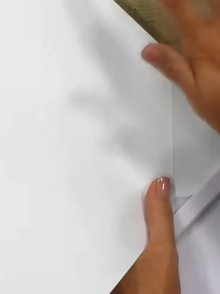 Step 9: Fold up the sides of your box, pinching the flaps at the corners to activate the hook and eye closures. The gl