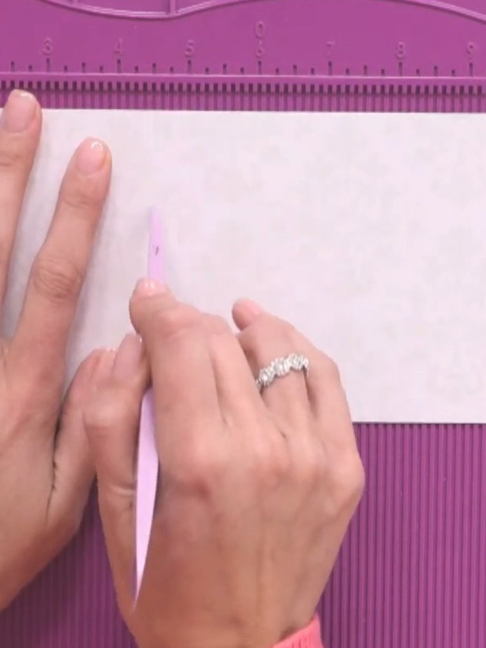 Step 5: Use scissors to taper the edges of the tunnel opening on the white card panel. This removes bulk and ensures t