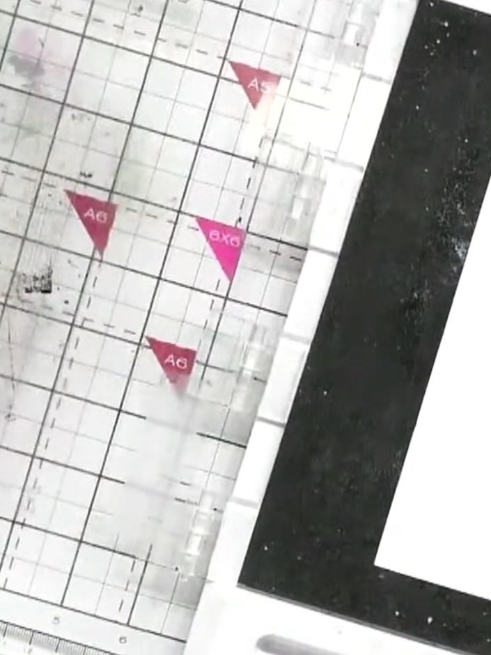 Step 3: Using a spot brush, gently dab pink ink onto the solid portion of the dress stamp. Work carefully to ink up th