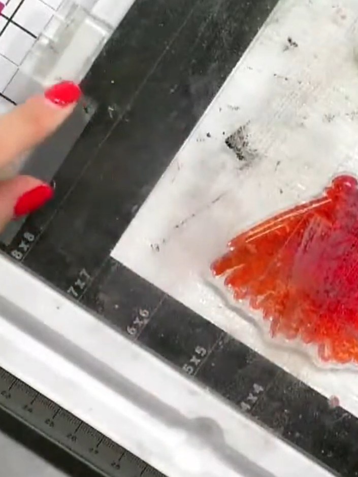Step 4: Add orange ink around the stamped dress design to complement the pink watercolour effect, creating a gradient 