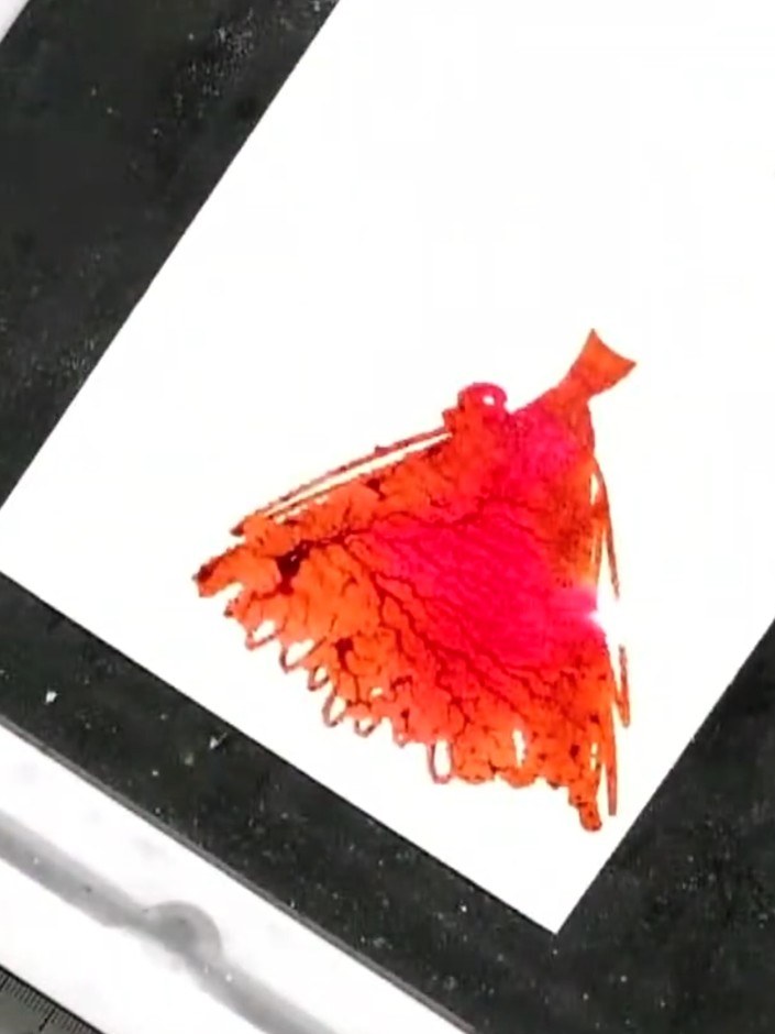 Step 5: Lightly spray the inked stamp with water to create a watercolour effect. The water will blend the pink and ora