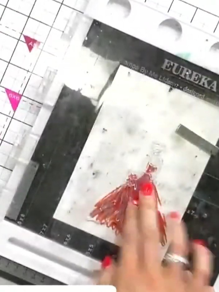 Step 7: Once the watercoloured area is dry, ink the outline portion of the stamp with black ink. Carefully stamp it ov