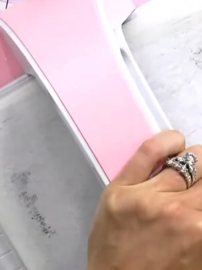 Step 2: Place your card stock inside the HD 3D embossing folder. Insert the folder into the embossing machine and run 