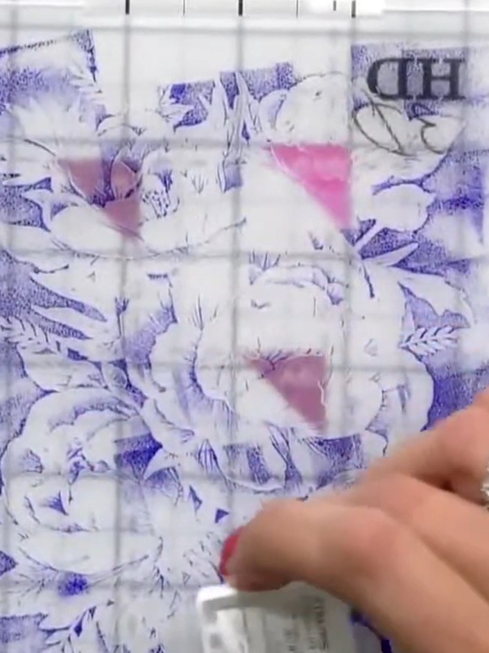 Step 6: Lightly spray the inked embossed design with water to create a watercolour effect. The water will blend and so