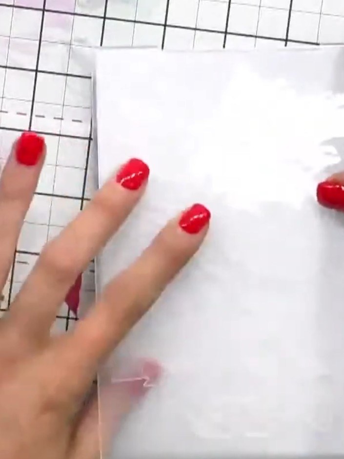 Step 8: Using a different ink colour, apply ink to another area of the embossed design to add depth and dimension. Cho
