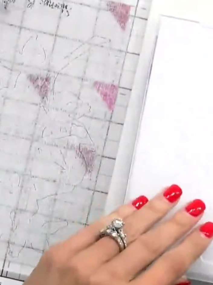 Step 9: Use a spot brush to lightly apply colour over specific areas of the embossed design to highlight details and b