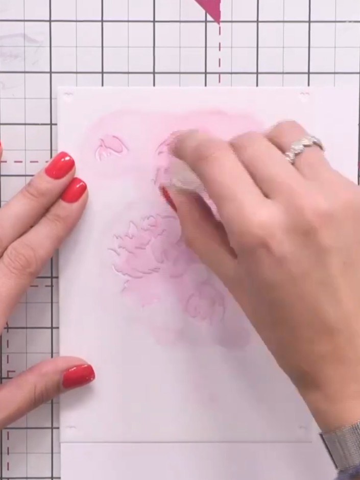Step 3: Position stencil two in the top corner of your card. Apply purple ink through the stencil to add depth to the 