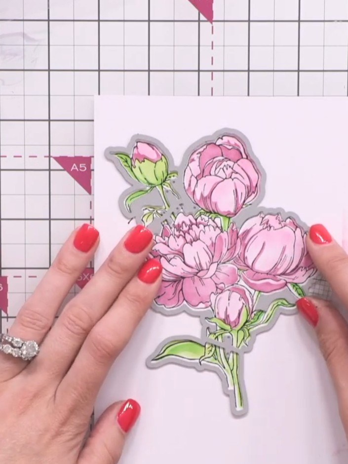Step 6: Position the outline die around your stamped peony design, ensuring it is lined up accurately. Run the die and