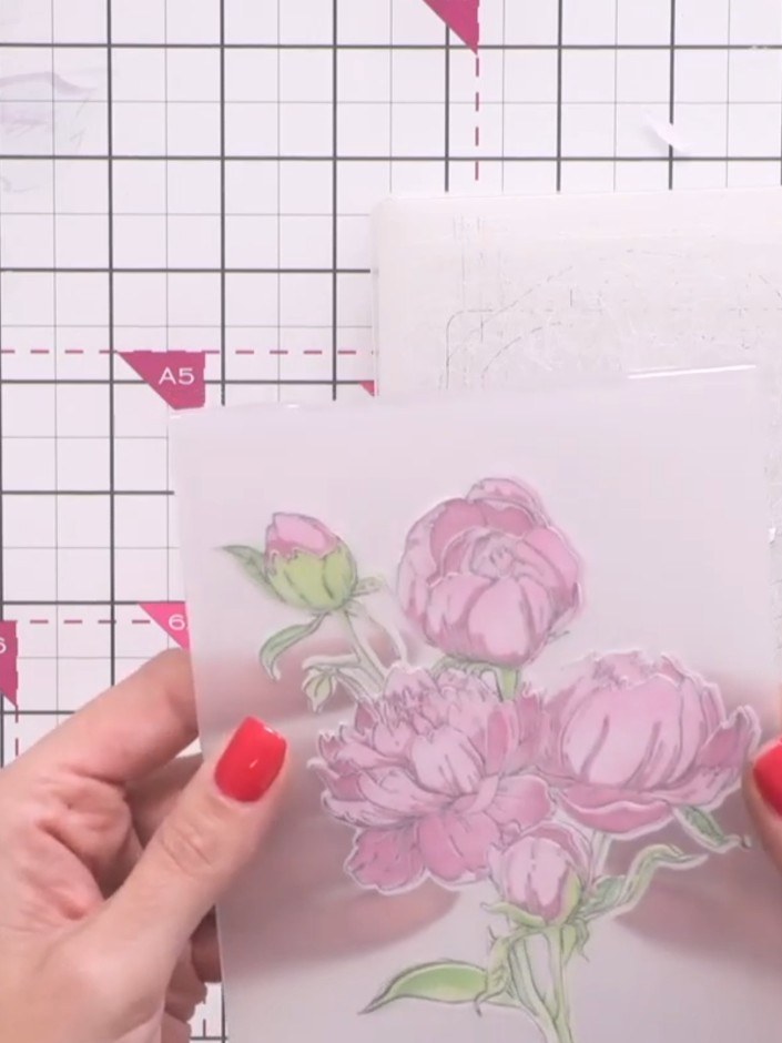 Step 8: Place the floral image inside the embossing folder and run it through your die-cutting machine to create the f