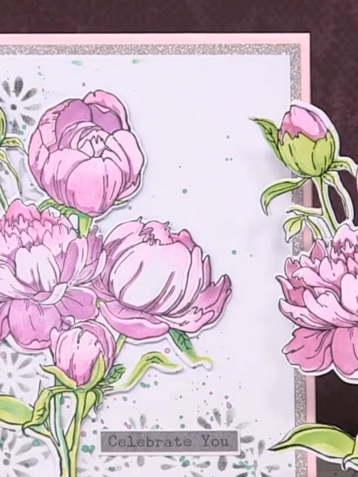 Step 9: Mount your completed peony embellishment onto a card blank with a silver glitter border. Add a 'Celebrate You'