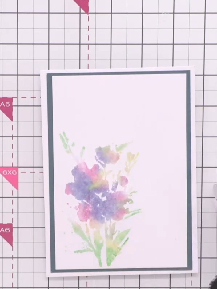 Step 10: Adhere the outline flower stamp to your acrylic block. Ink the stamp with black ink using your ink pad.