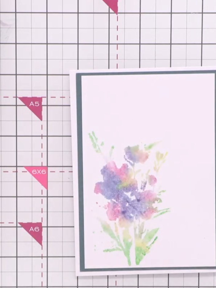 Step 9: Lift the stamp away from the card to reveal the beautiful watercolour floral image in purple, pink, yellow and