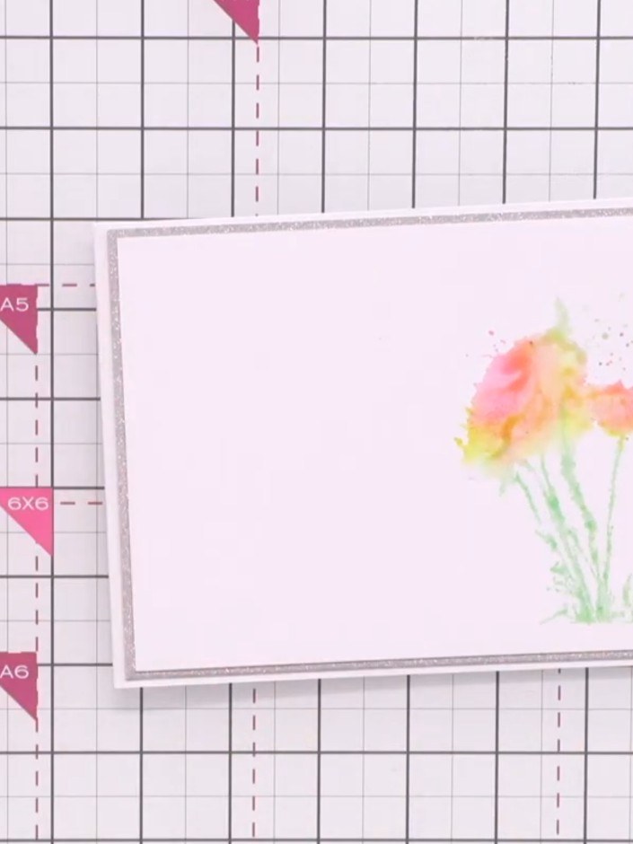 Step 4: Apply green ink to the base of the floral stamp to create the landscape stems and foliage at the bottom of the