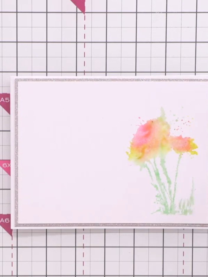 Step 5: Spray water onto the stamped image to help blend the colours together naturally and create a soft watercolour 