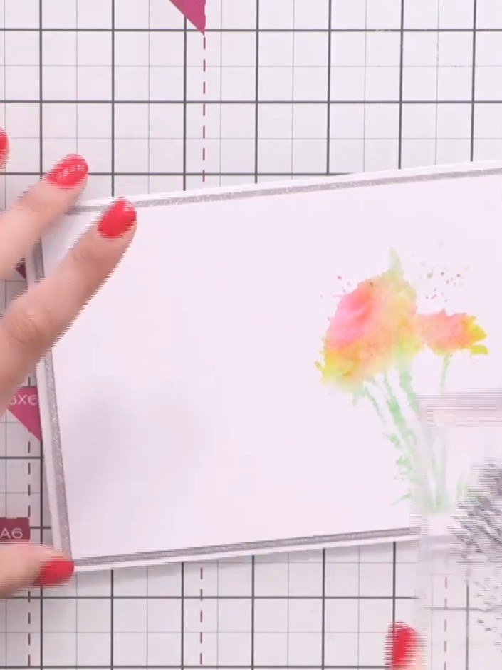 Step 7: Stamp the outline floral image from the collection over your watercoloured design using black ink to add detai