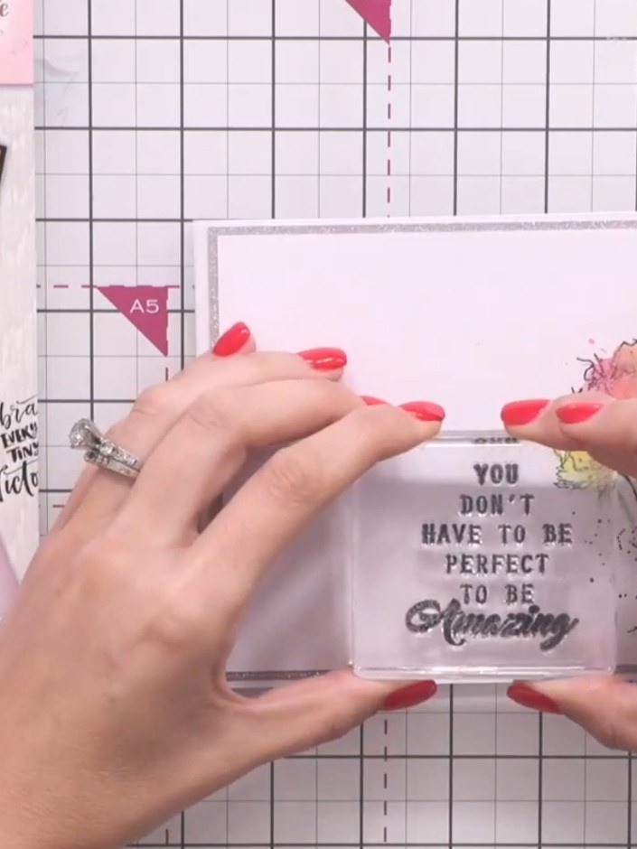 Step 9: Stamp your chosen sentiment from the set onto the card front using black ink. Position the sentiment centrally