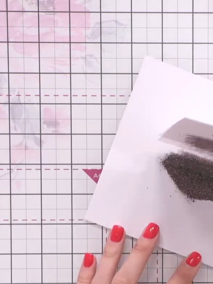 Step 7: Tap off any excess embossing powder back into the container. The powder can be reused, so ensure you collect i
