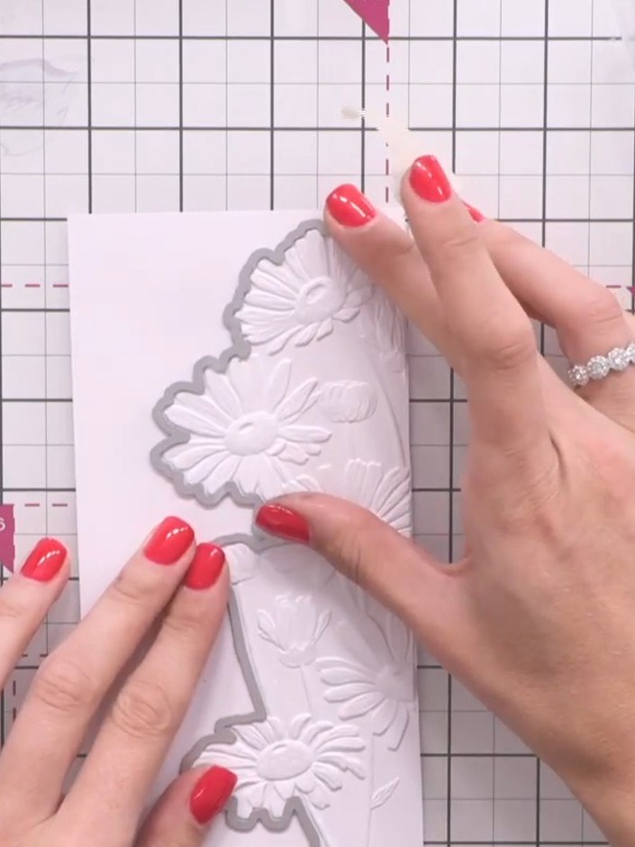 Step 7: Run the embossed cardstock and die through your cutting machine to cut out the design with a clean, precise ed