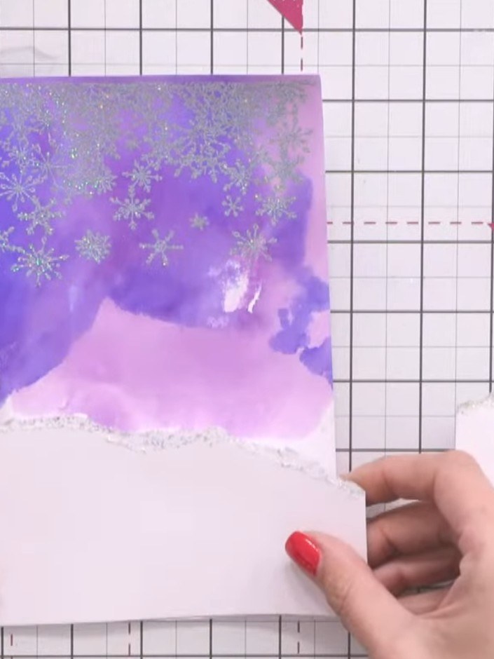 Stap 14: Using scissors, carefully cut away the pillar sections from the coloured house image to simplify the fussy cut