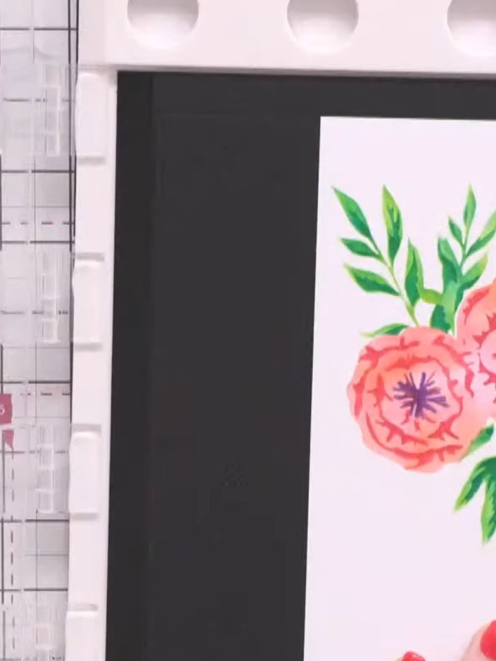 Passo 10: Stamp the Spring Blooms design in black ink onto both stencilled cards. Position the stamp in the corner of a 