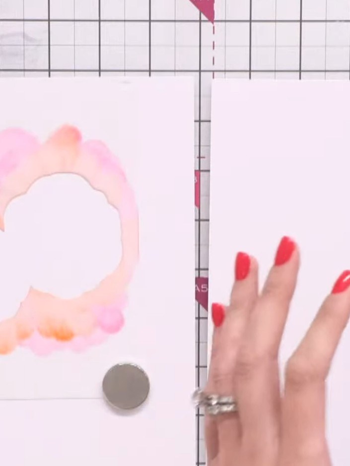 Passo 3: Apply magenta ink through the stencil using a blending technique, creating a sporadic ghostlike effect rather 