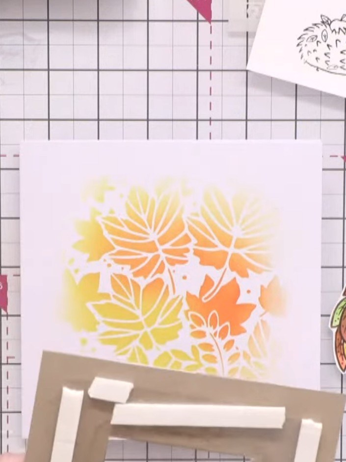 Passo 12: Cut out the coloured wreath and adhere it to the acetate window using foam pads to create dimension and make i