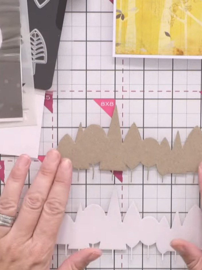 Passo 1: Apply double-sided adhesive sheet to the reverse of your kraft card stock before die cutting the tree line sha