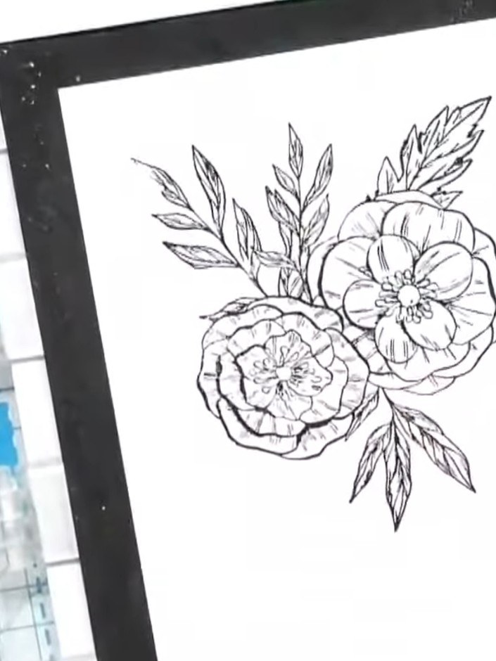 Passo 1: Stamp the spring blooms design onto white cardstock using a black ink pad to create the flower outline. Press 