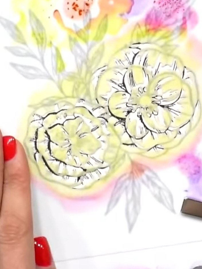 Passo 3: Take a very small amount of magenta pink ink on your brush and gently stencil through the flower areas to crea