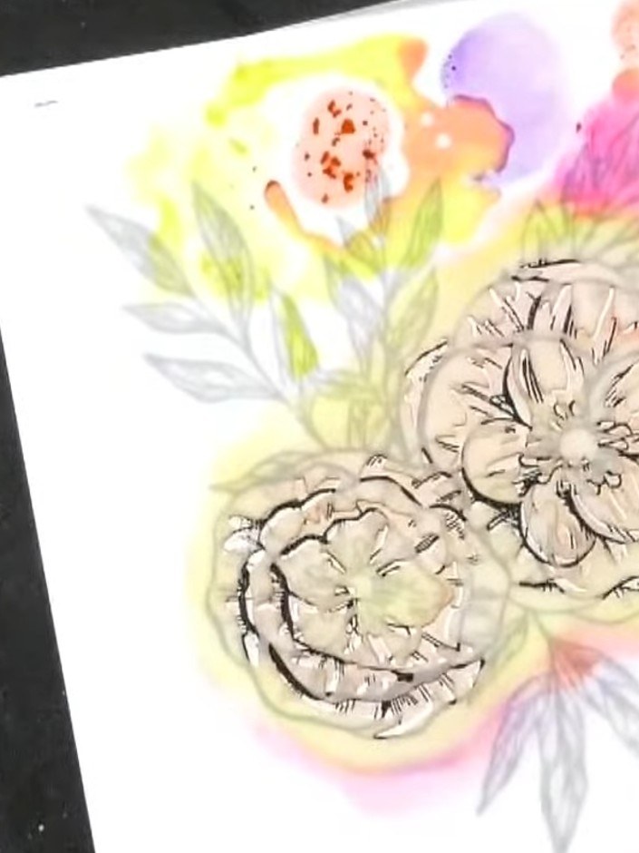 Passo 5: Position stencil three over your card and apply green ink around the flower petals to create foliage. Use a li