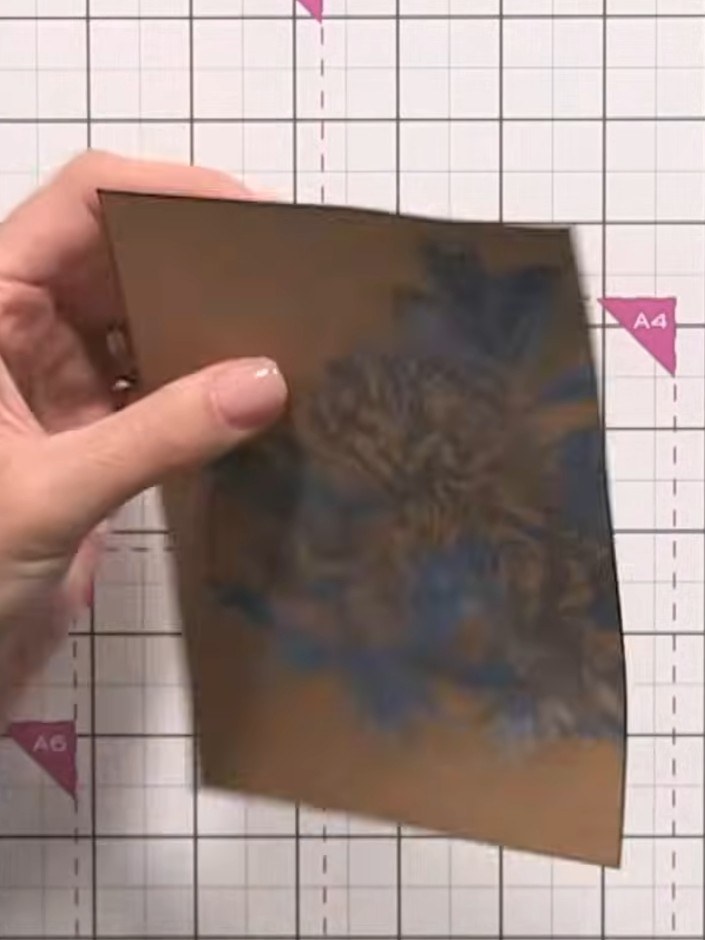 Step 10: Using a black ink pad held at an angle, carefully edge the entire stencilled piece to add definition and depth