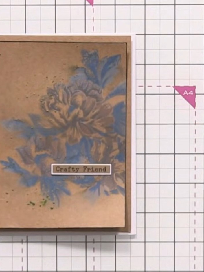 Step 12: Add a sentiment label to the card using washi tape or stamps. Finish with gold ink splats using a stencil or f