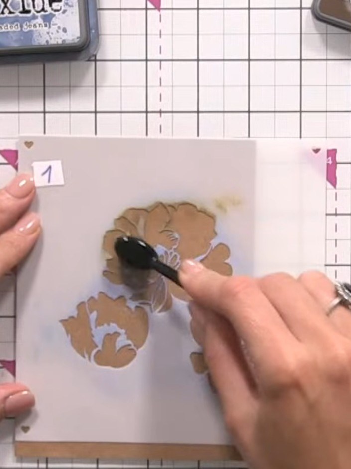 Step 3: Apply walnut brown ink through the first stencil using light pressure. Press gently to build the colour gradua