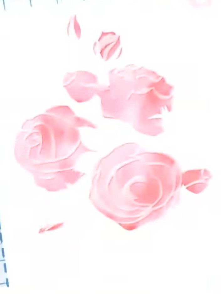 Paso 4: Position stencil number three over your design and apply a darker pink shade through the stencil using a blend