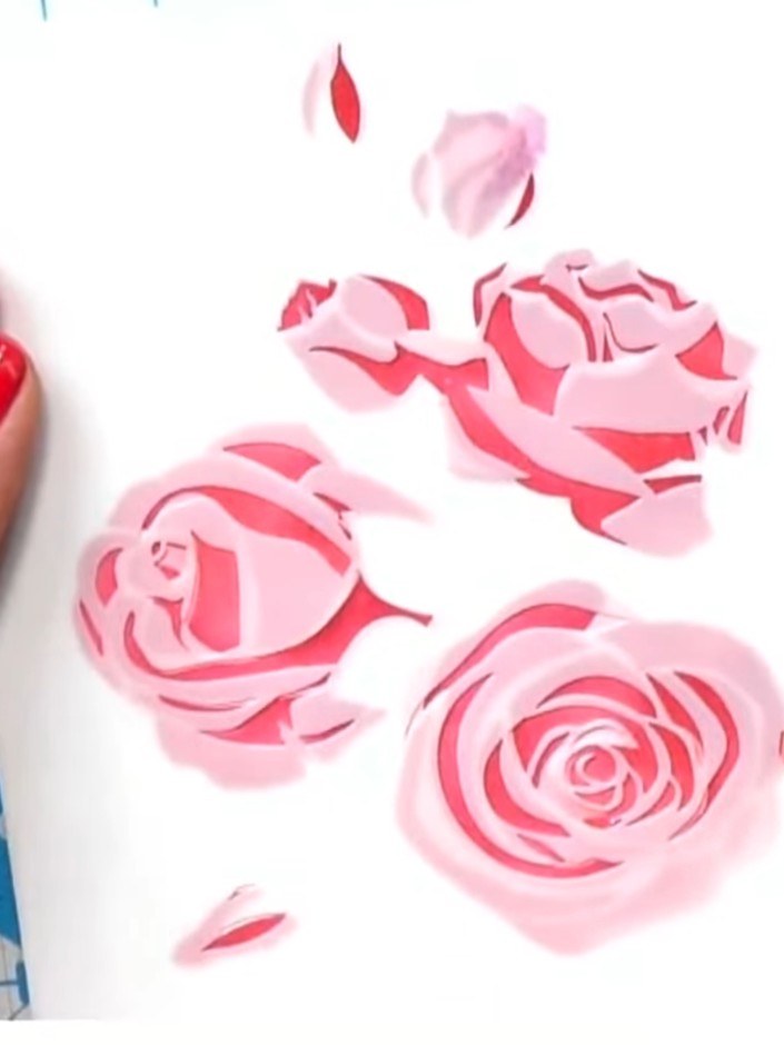 Paso 6: Use stencil number five with your darkest pink or red ink pad to add the final layer of detail to the roses. T